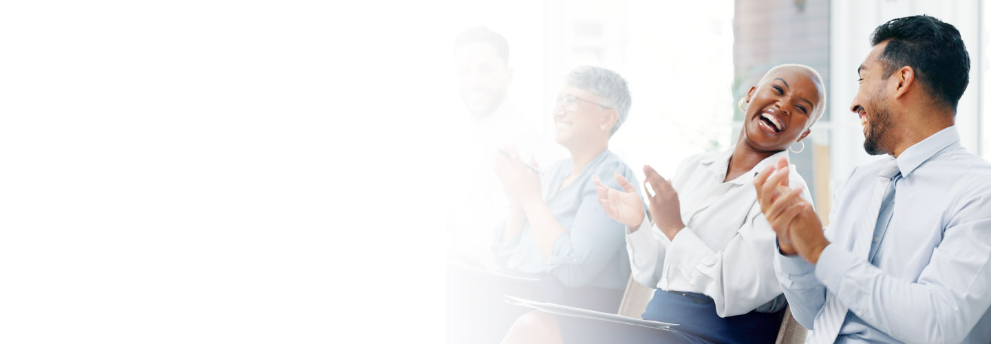 Employees laughing in a corporate environment
